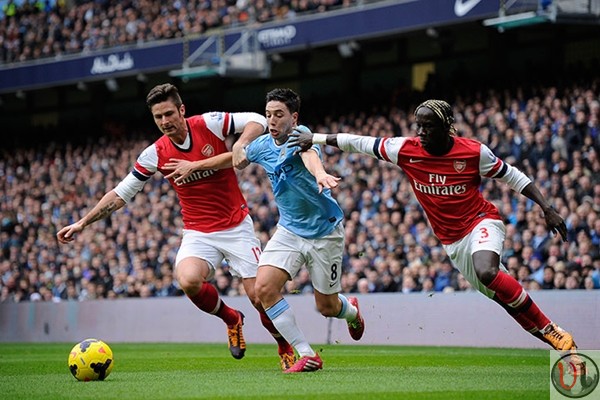City's Samir Nasri battles Giroud and Sagna of Arsenal