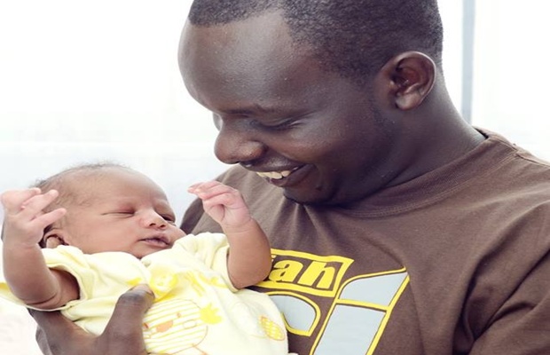 Anthony Ndiema with his first born called Joshua , in 2013
