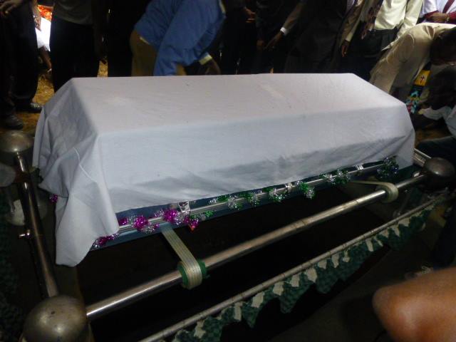bishop bahati casket being lowered
