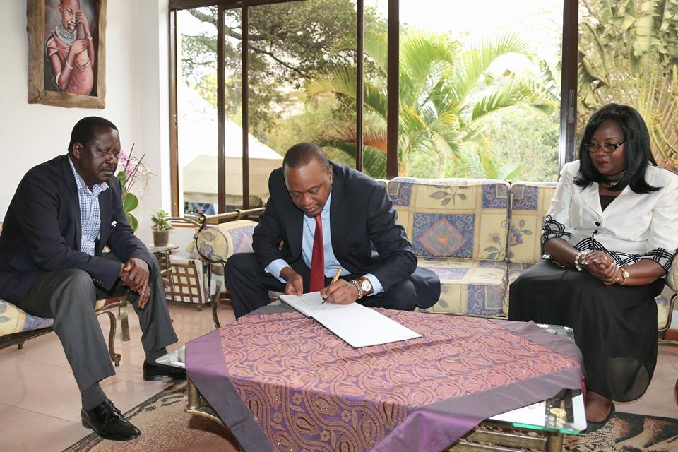 Uhuru writing a message of condolence 