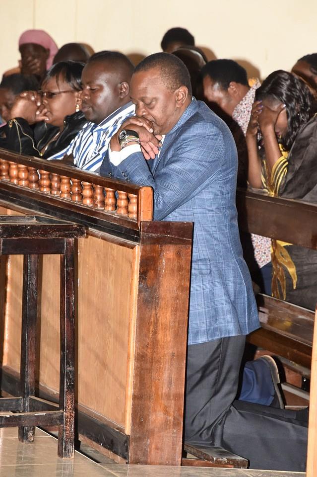 uhuru kneels in church